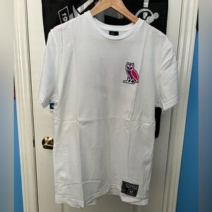 White OVO Athletics t-shirt with pink and purple owl graphics